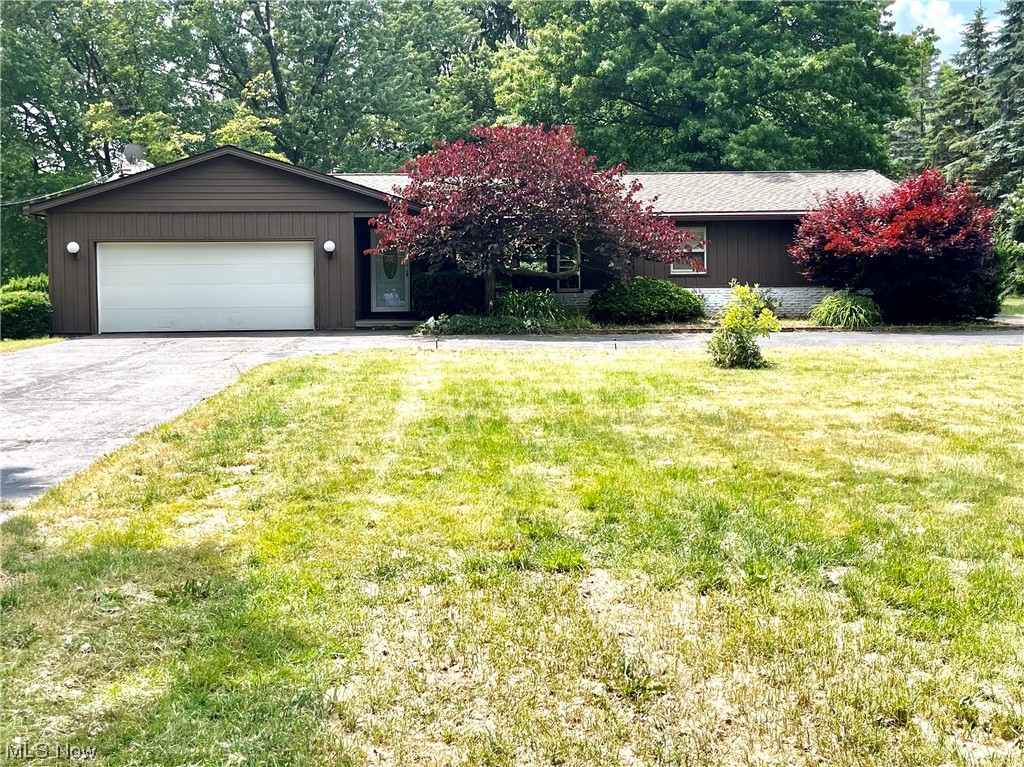 15220 Hatfield Road Rittman, OH 44270 - Photo 1 of 23 Welcome home to Country Living with your 1 acre lot, 3 bedroom 3 bath ranch, family room, recreation room , double garage plus additional 1 car detached garage to the right of the home and a barn to the left rear of the home.