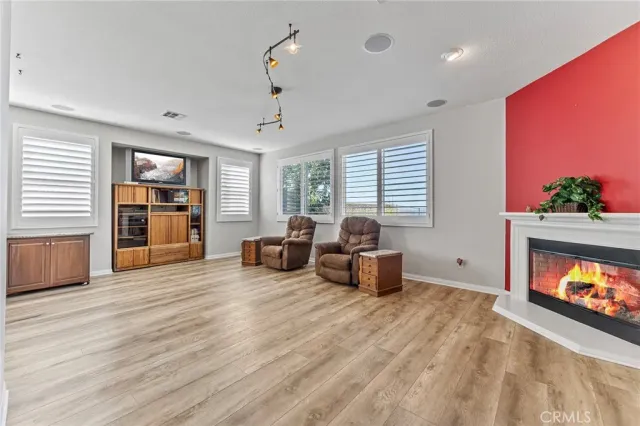 a living room with furniture window and fireplace