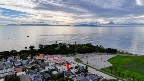 a view of a lake with a floor to ceiling window
