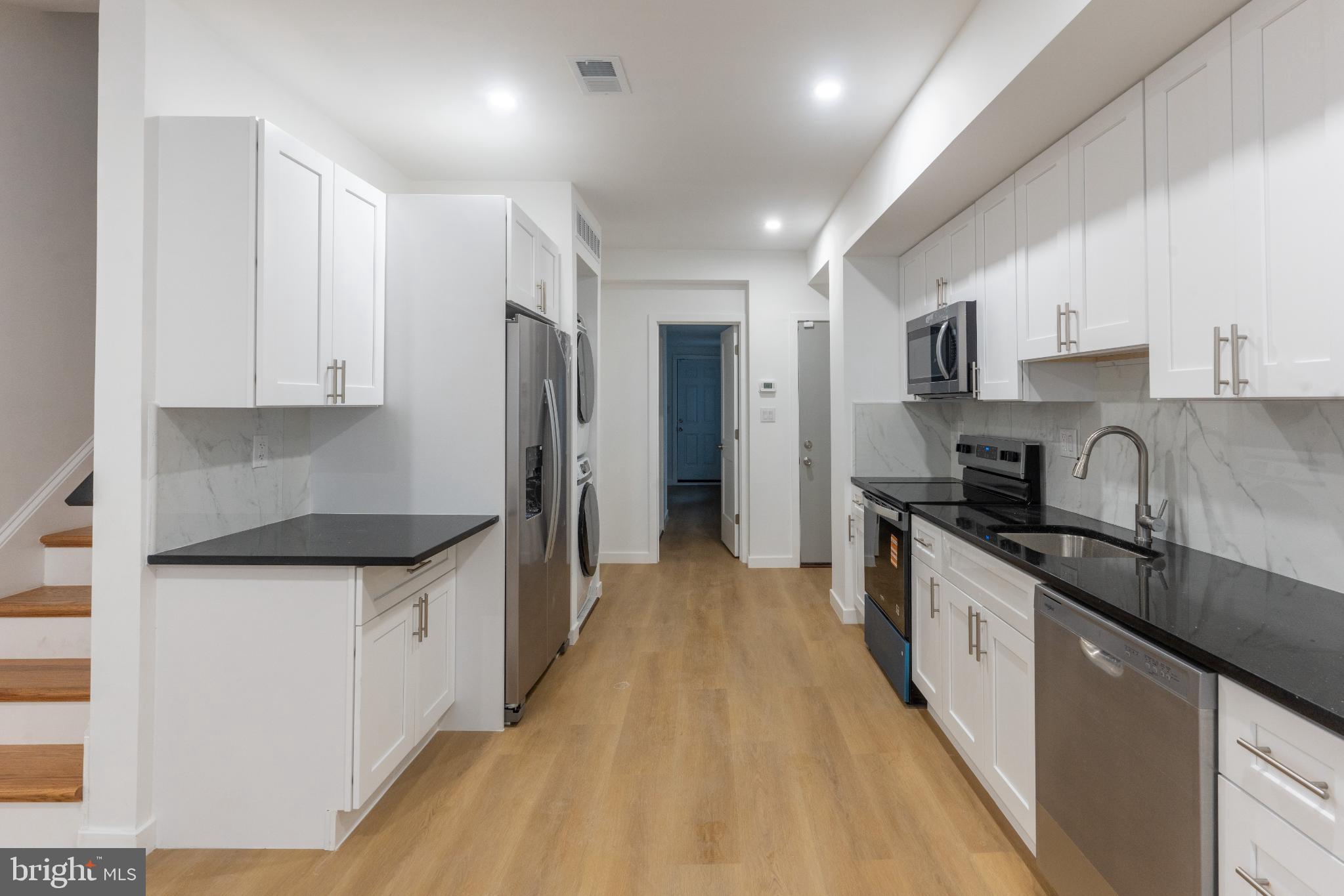 3631 Warren Street Philadelphia, PA 19104 - Photo 9 of 27 Sleek modern kitchen with elegant finishes.