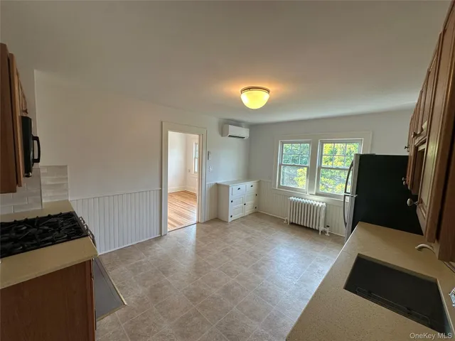 a view of workspace with window and fan