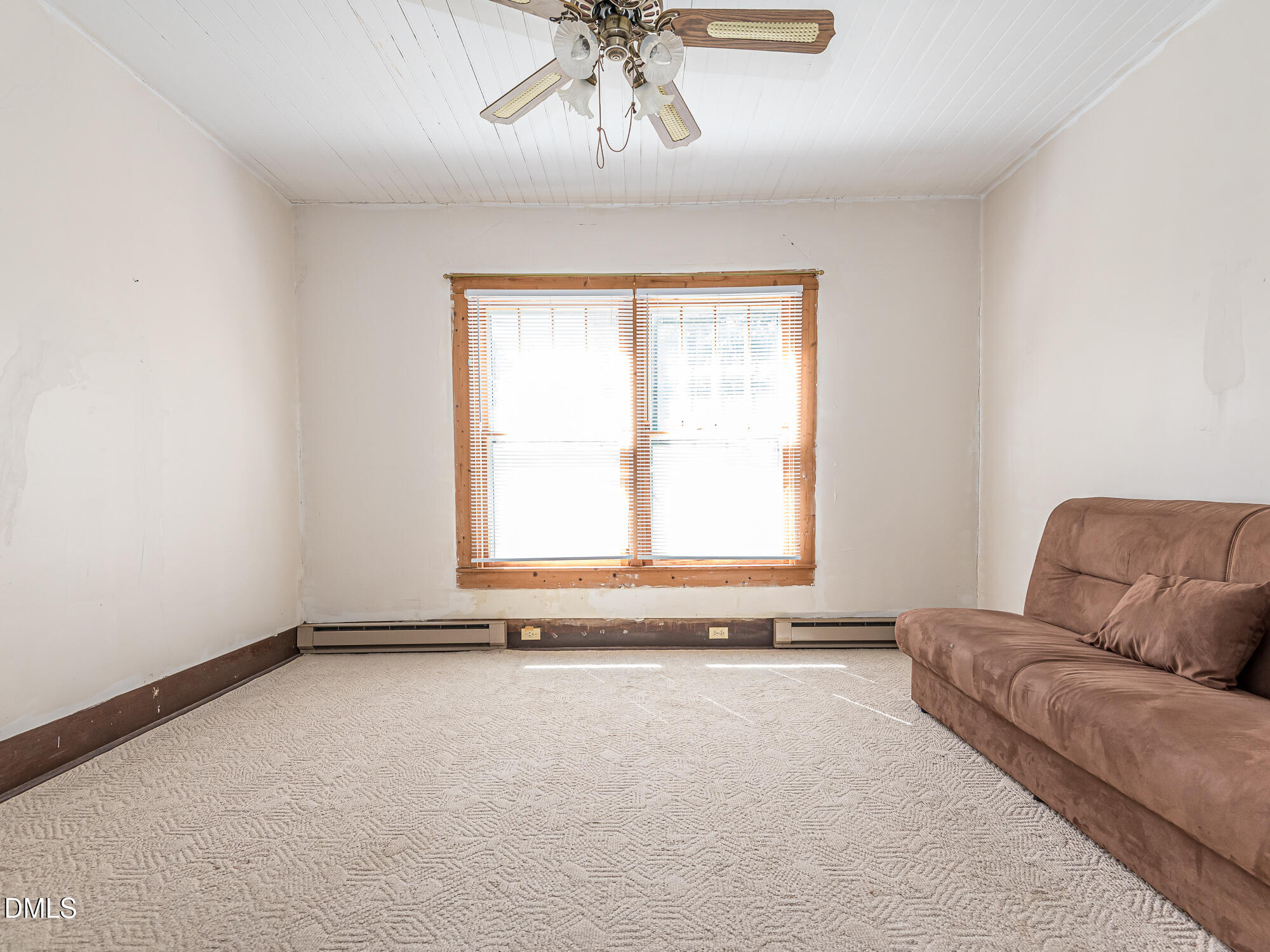 381 Royal Road Roseboro, NC 28382 - Photo 20 of 30 a living room with a couch and a window