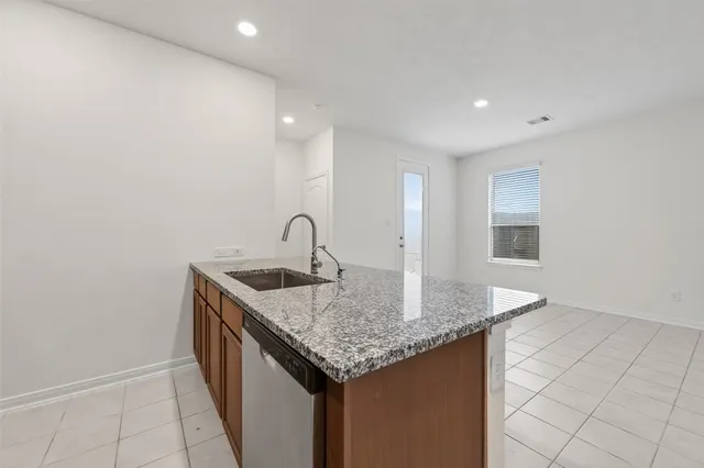 a stove top oven sitting inside of a kitchen