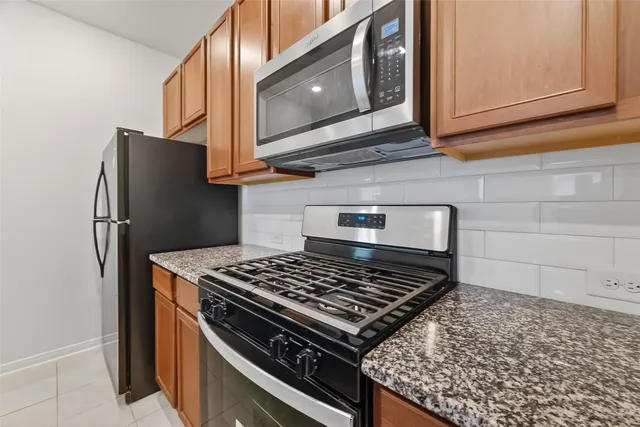 an empty room with white walls and tiles