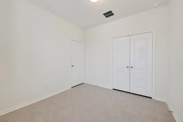 a bathroom with a granite countertop sink a toilet and a bathtub