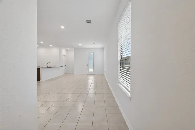 a view of an empty room and window