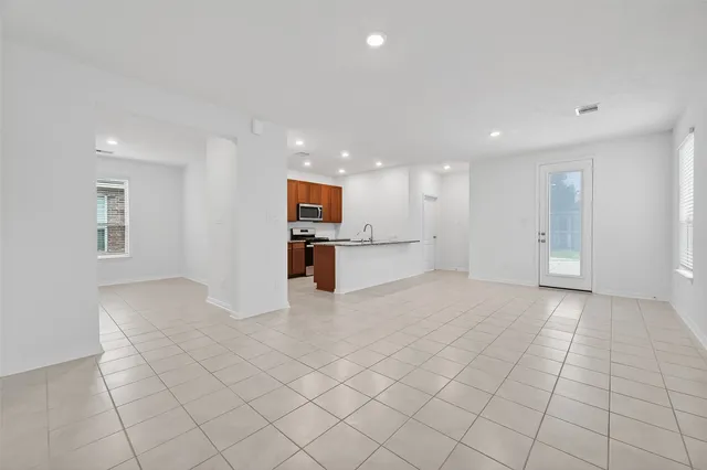 a view of an empty room with a window