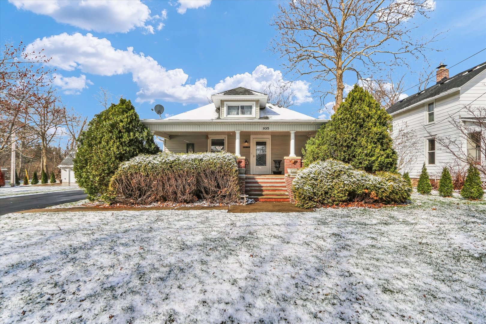 105 South Division Street Mahomet, IL 61853 - Photo 1 of 45 a front view of a house with a garden