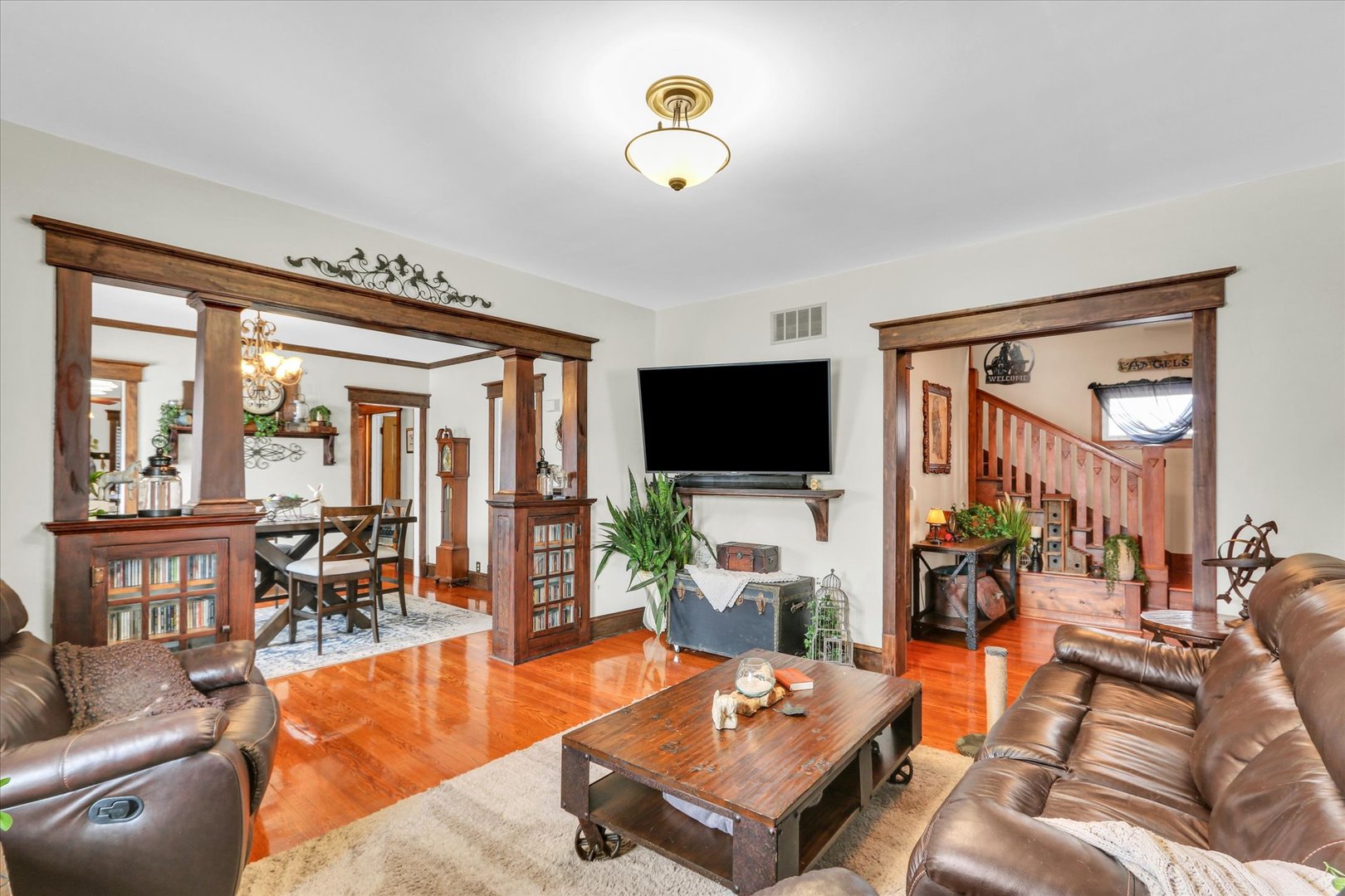 105 South Division Street Mahomet, IL 61853 - Photo 12 of 45 a living room with furniture and a flat screen tv