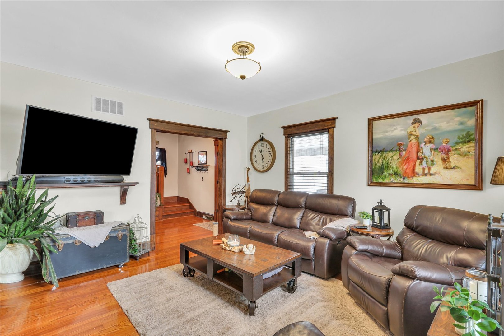105 South Division Street Mahomet, IL 61853 - Photo 13 of 45 a living room with furniture and a flat screen tv