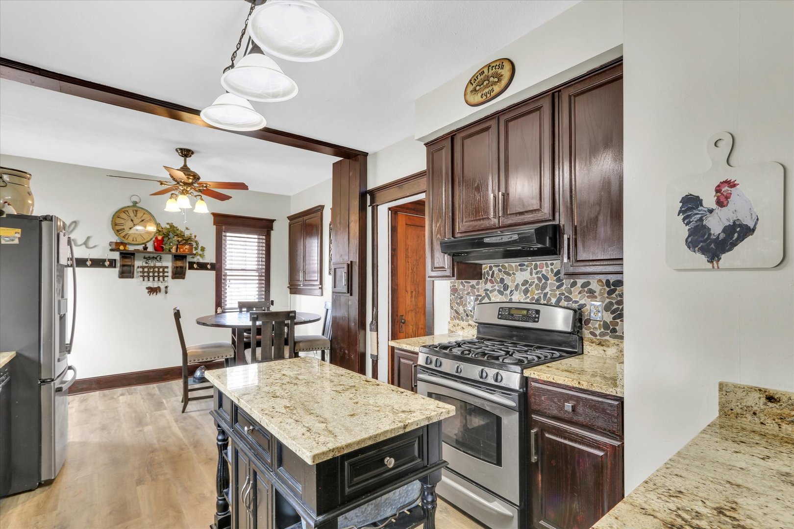 105 South Division Street Mahomet, IL 61853 - Photo 16 of 45 a kitchen with cabinets and wooden floor