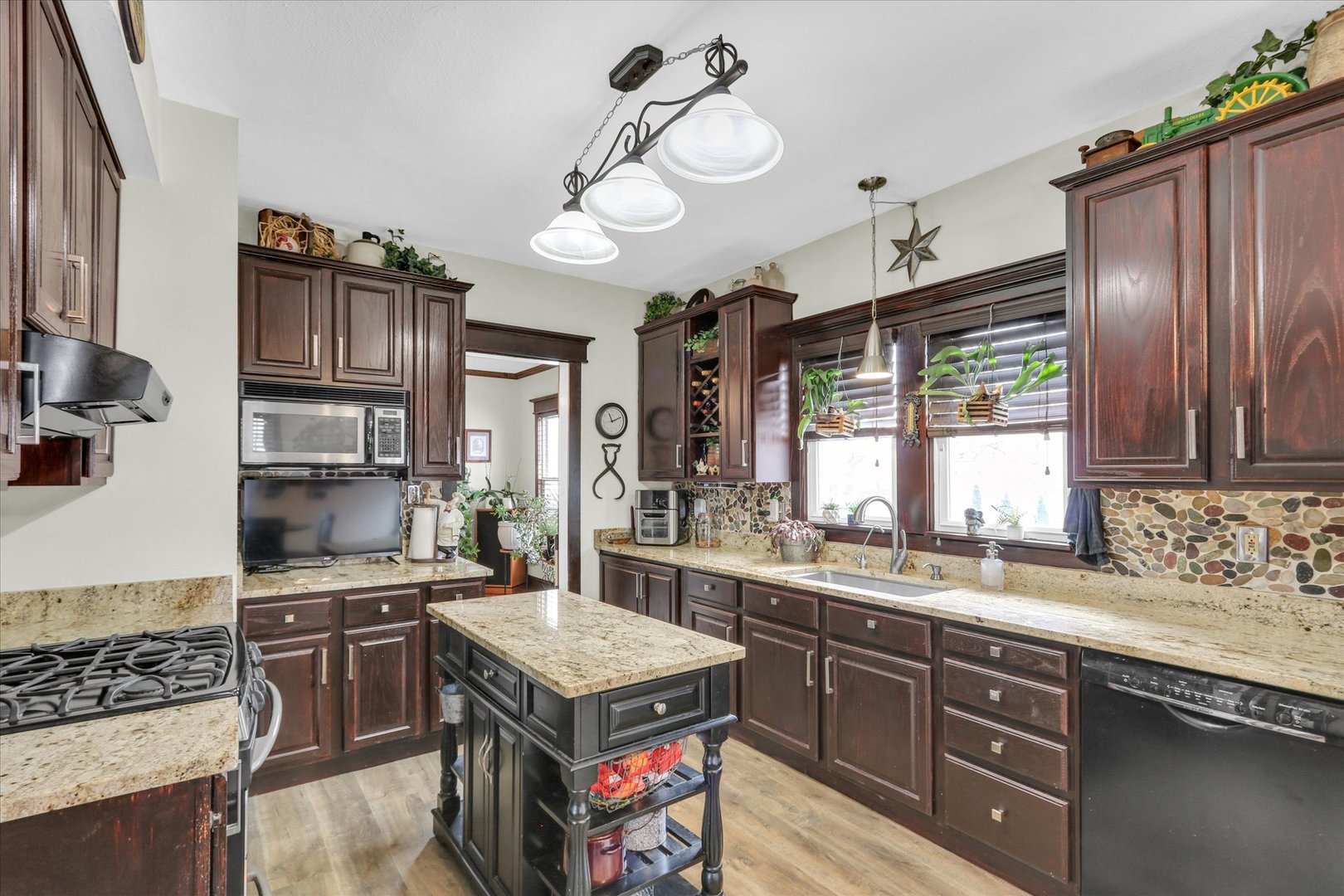 105 South Division Street Mahomet, IL 61853 - Photo 18 of 45 a kitchen with a stove and a sink