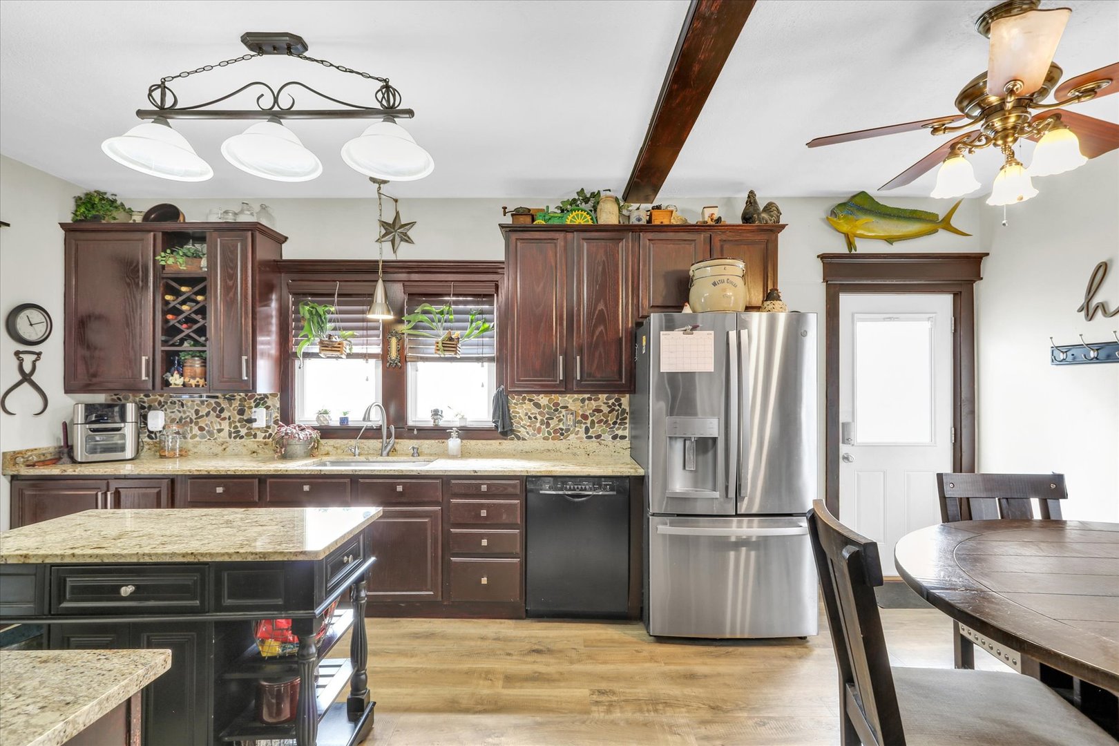 105 South Division Street Mahomet, IL 61853 - Photo 19 of 45 a kitchen with stainless steel appliances granite countertop a stove and refrigerator
