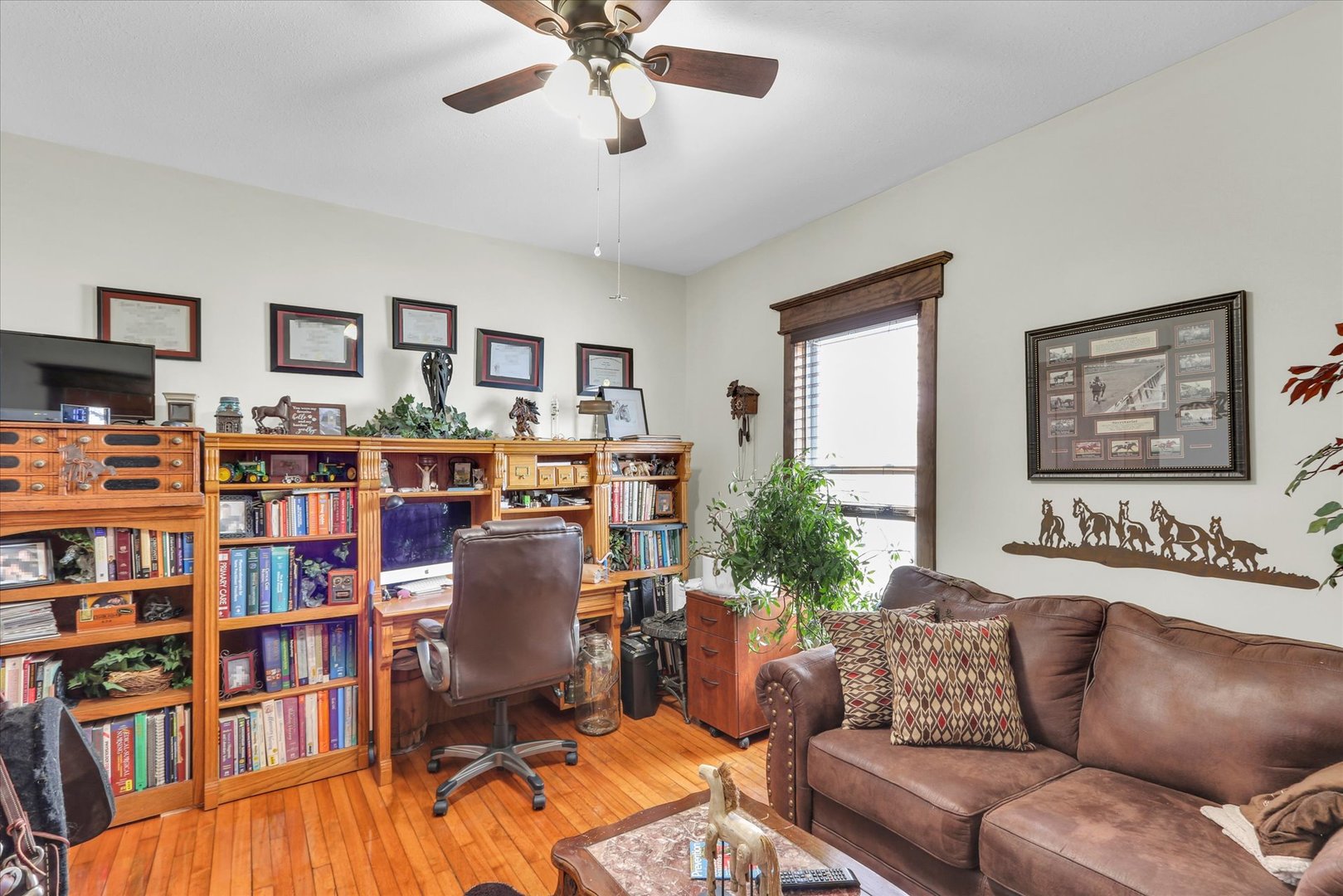 105 South Division Street Mahomet, IL 61853 - Photo 22 of 45 a living room with furniture and a bookshelf