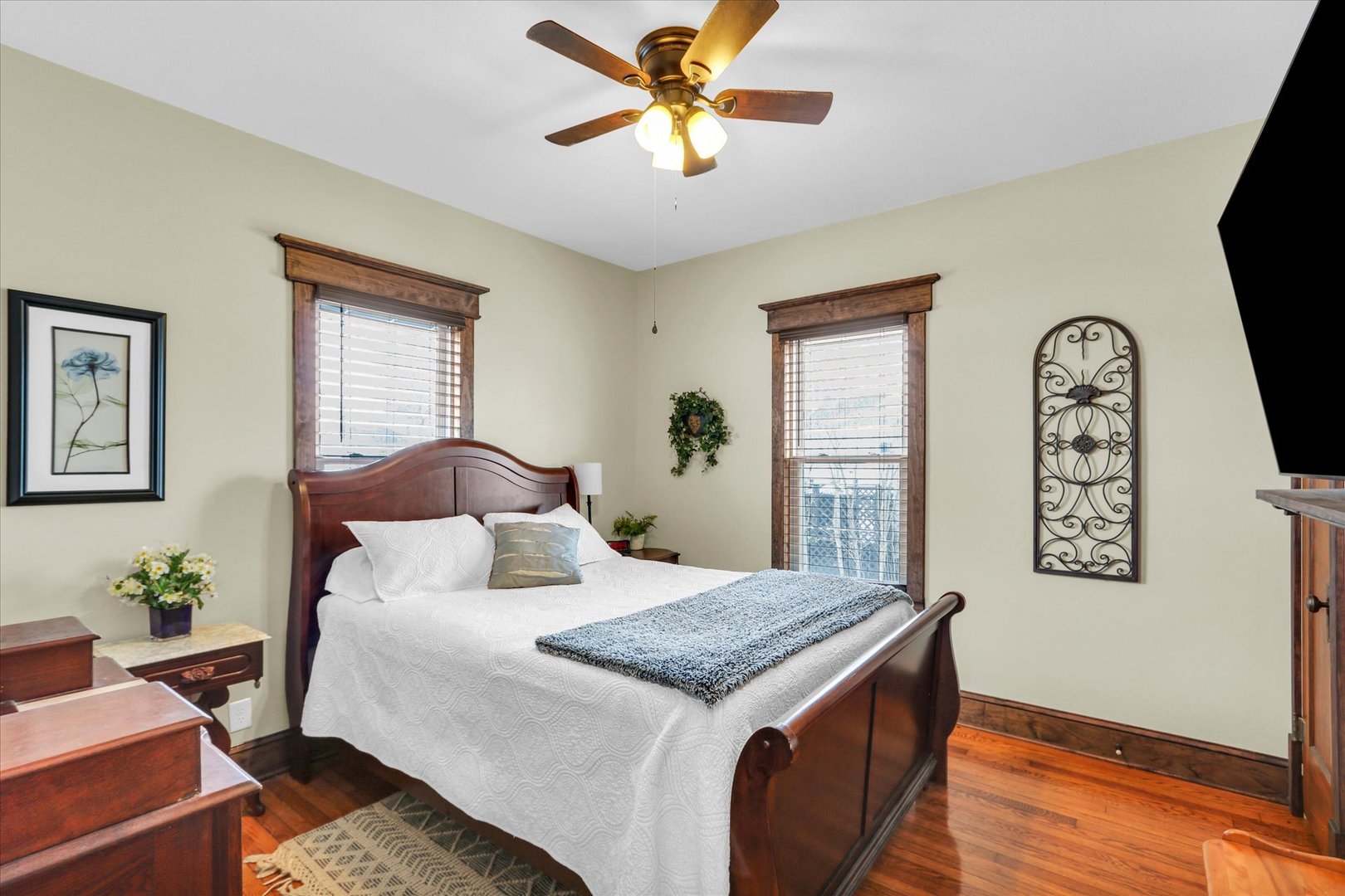 105 South Division Street Mahomet, IL 61853 - Photo 23 of 45 a bedroom with a bed and a chandelier