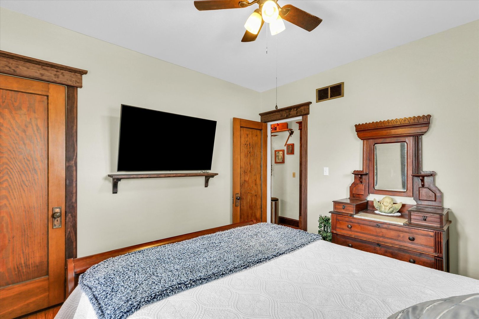 105 South Division Street Mahomet, IL 61853 - Photo 24 of 45 a bedroom with a bed and a flat screen tv