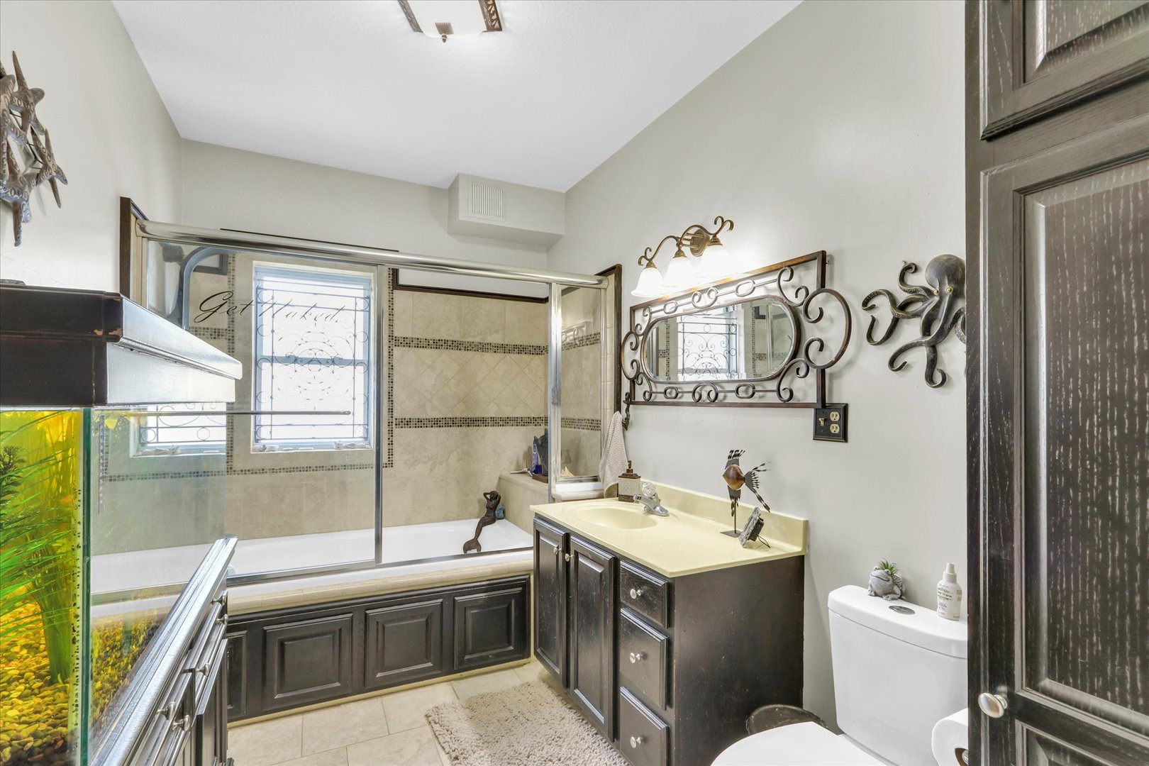 105 South Division Street Mahomet, IL 61853 - Photo 25 of 45 a bathroom with a toilet sink and mirror