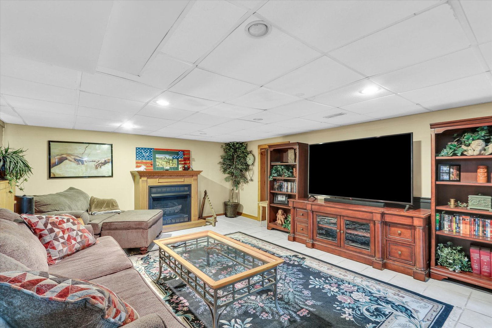 105 South Division Street Mahomet, IL 61853 - Photo 32 of 45 a living room with furniture and a flat screen tv