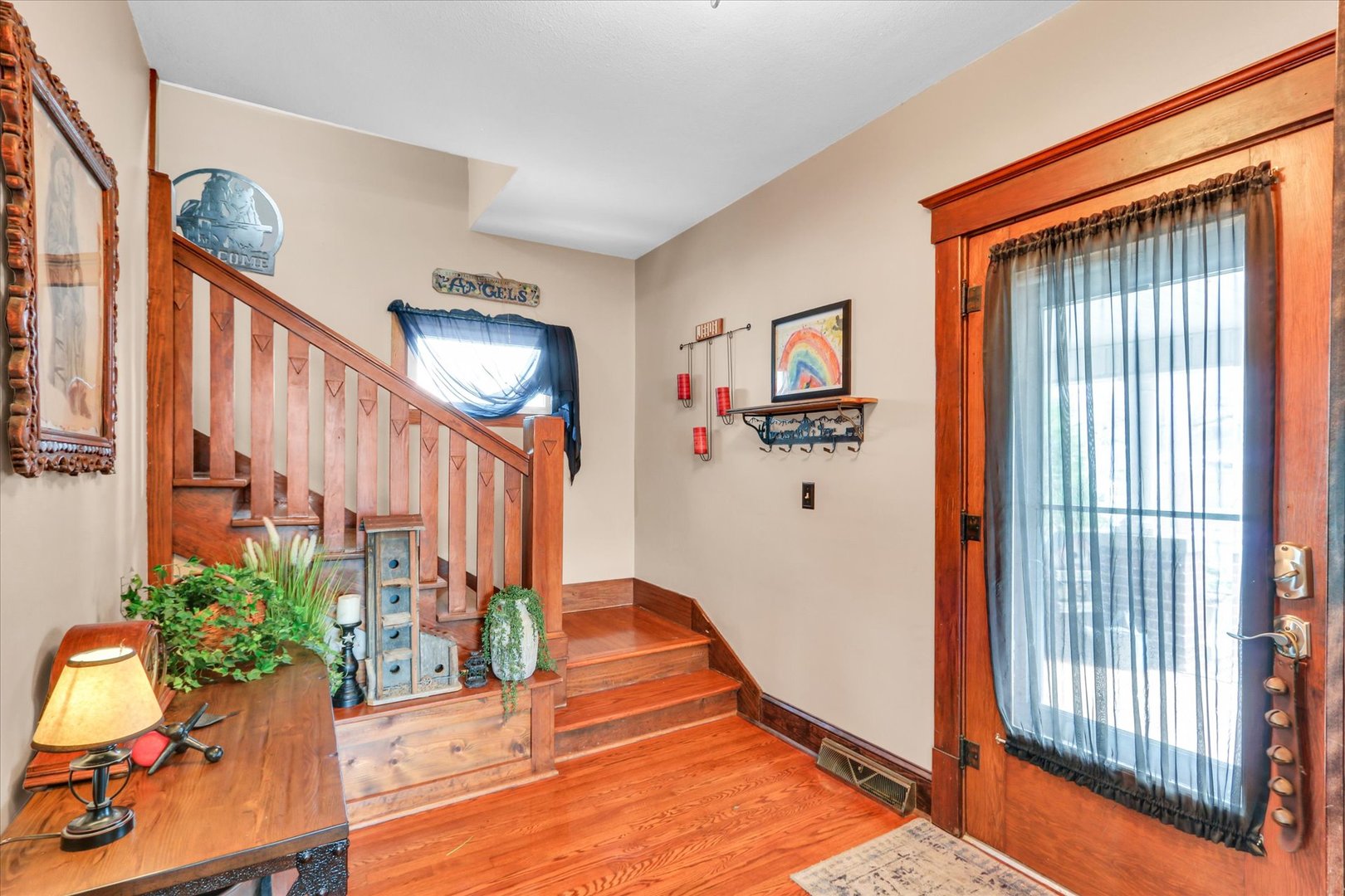 105 South Division Street Mahomet, IL 61853 - Photo 8 of 45 a view of an entryway with wooden floor