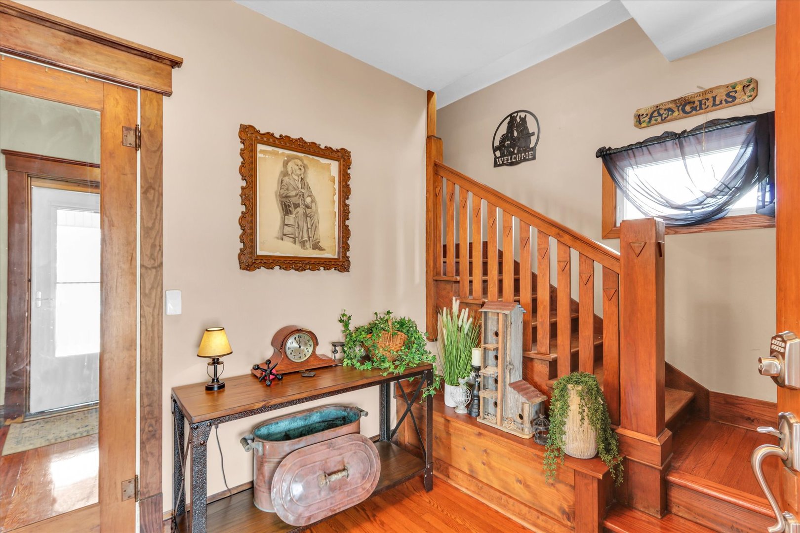 105 South Division Street Mahomet, IL 61853 - Photo 9 of 45 a view of an entryway with wooden floor