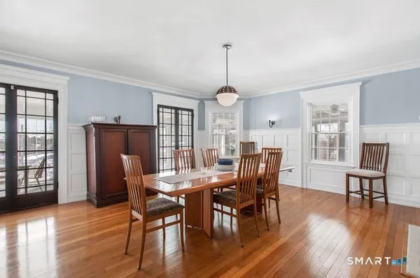 a view of a dining room with furniture window and wooden floor