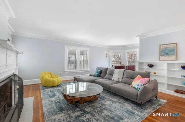 a living room with furniture and a fireplace