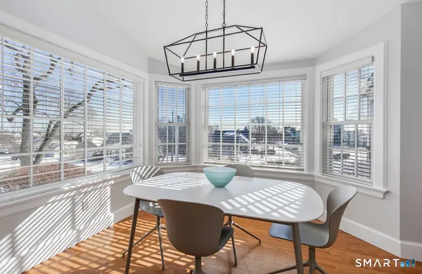 a view of a dining room with furniture window and outside view