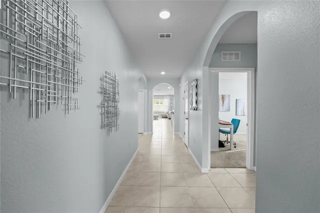 a view of a hallway with wooden shelves