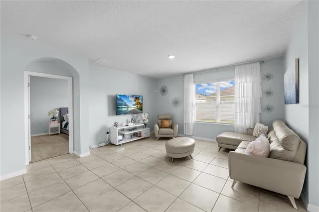 a living room with furniture and a window