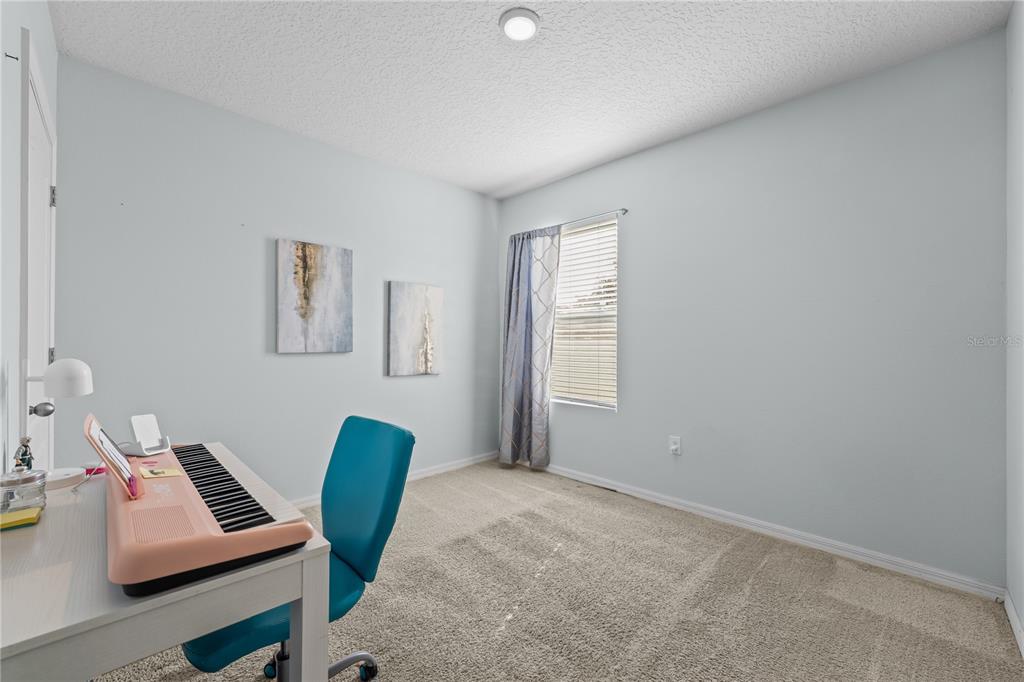 1833 Bluepoint Street St. Cloud, FL 34771 - Photo 38 of 46 a workspace with furniture and a window