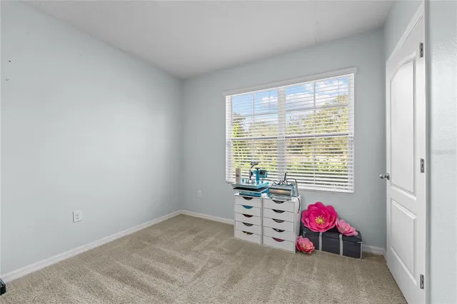 a view of room with window and furniture