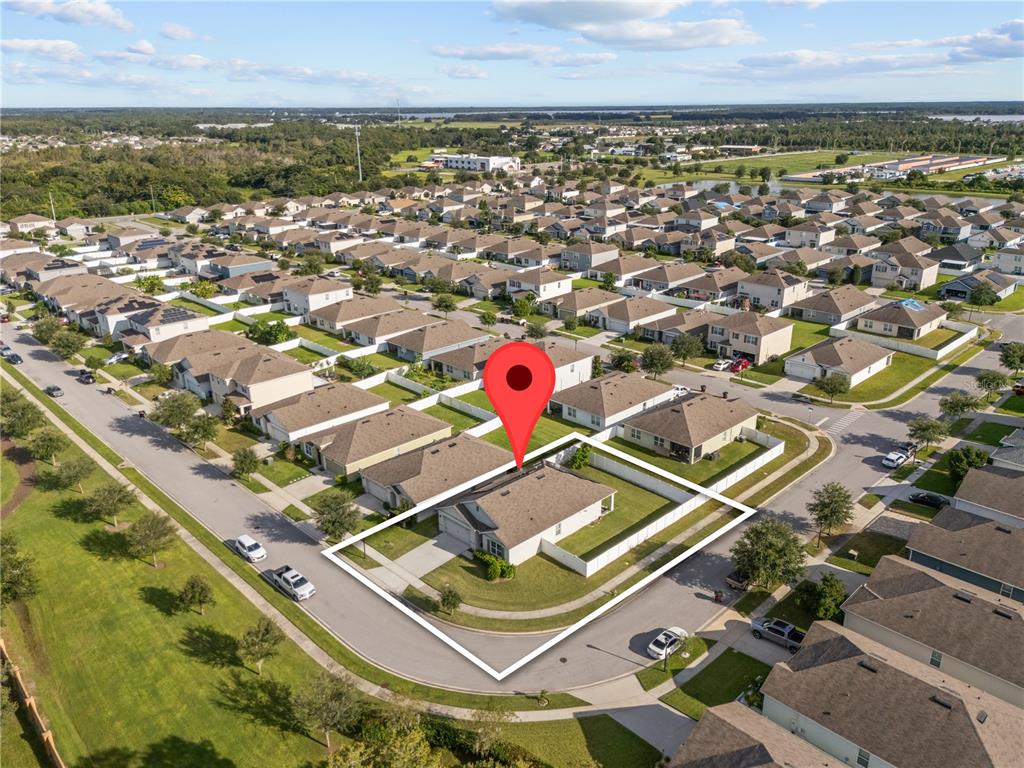 1833 Bluepoint Street St. Cloud, FL 34771 - Photo 4 of 46 an aerial view of residential houses with outdoor space