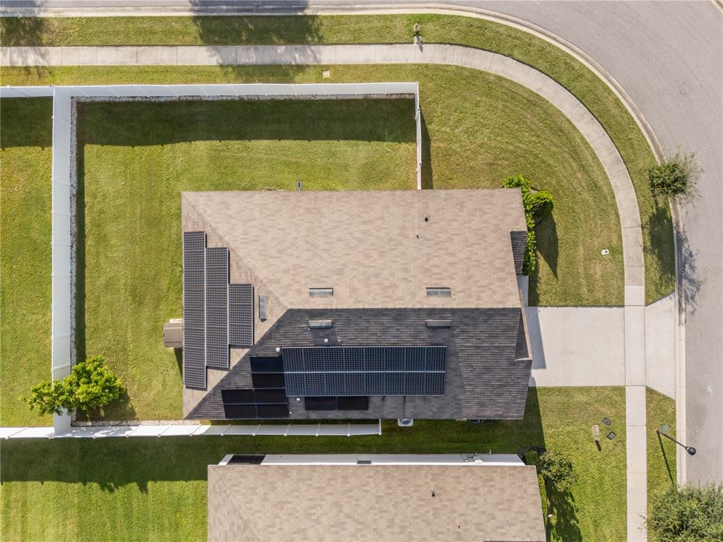 1833 Bluepoint Street St. Cloud, FL 34771 - Photo 6 of 46 a front view of a house with a garden