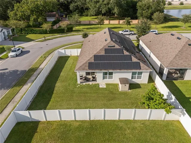 a view of a swimming pool with a yard