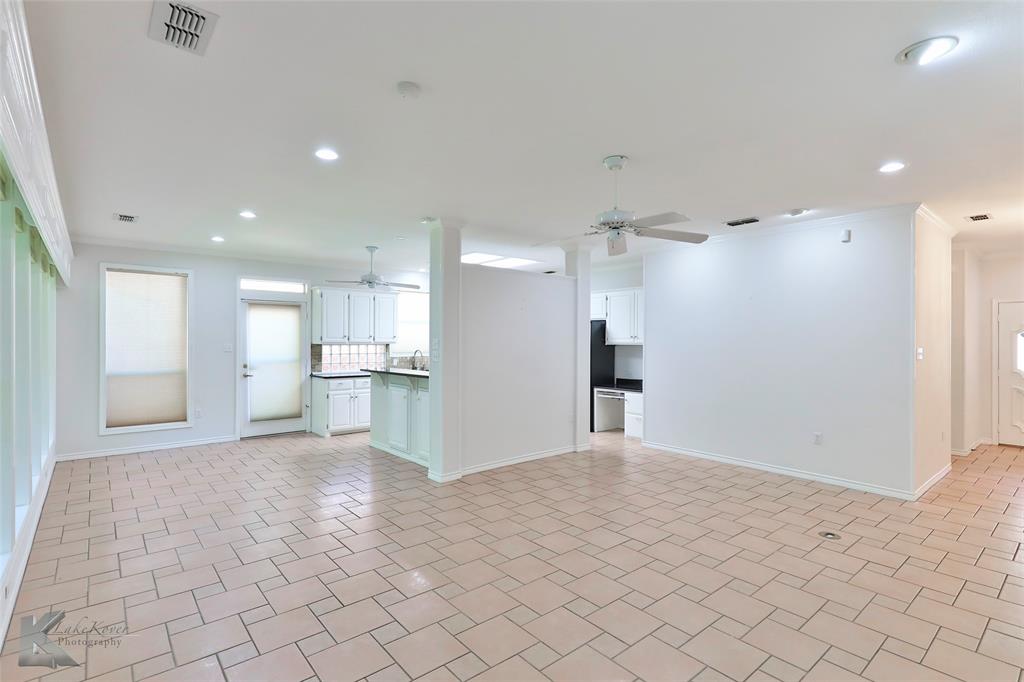 106 Riverside Park Abilene, TX 79605 - Photo 15 of 40 a view of a kitchen with a refrigerator and a sink