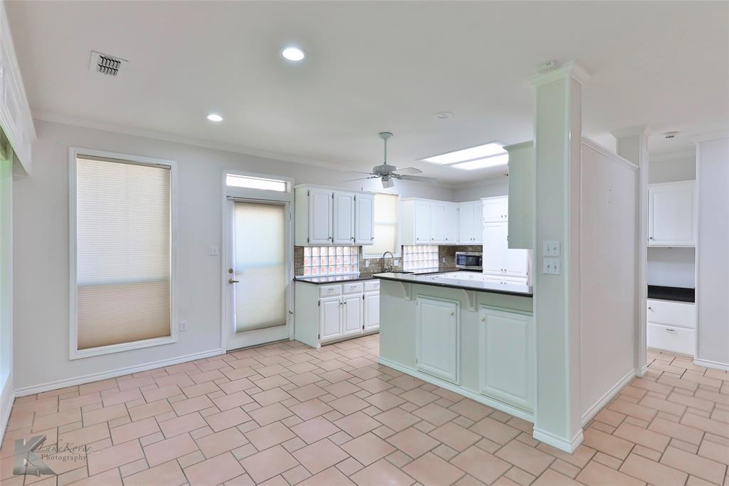 106 Riverside Park Abilene, TX 79605 - Photo 16 of 40 a kitchen with a sink and cabinets