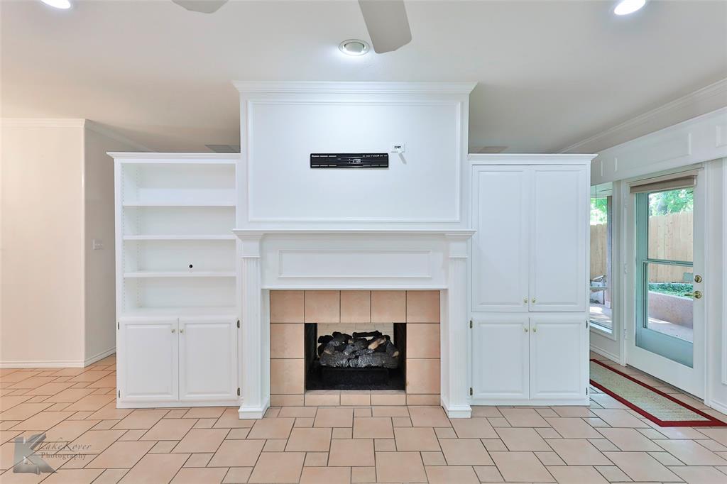 106 Riverside Park Abilene, TX 79605 - Photo 17 of 40 a living room with furniture and a fireplace