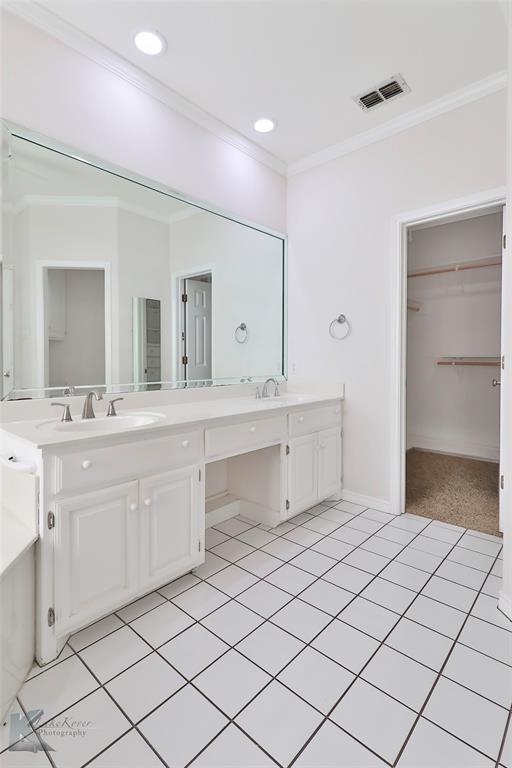 106 Riverside Park Abilene, TX 79605 - Photo 21 of 40 a bathroom with a sink vanity and mirror
