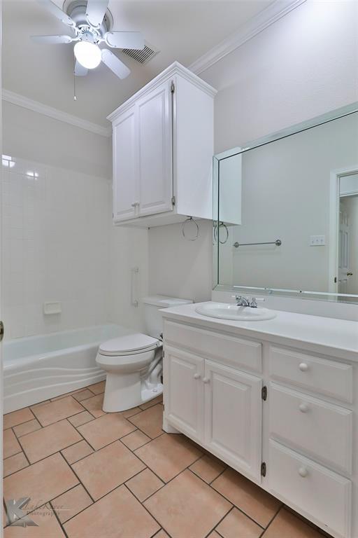 106 Riverside Park Abilene, TX 79605 - Photo 29 of 40 a bathroom with a toilet sink and mirror