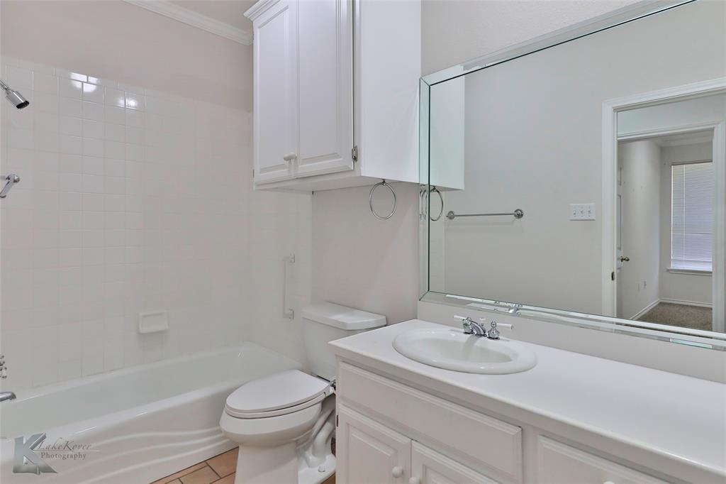 106 Riverside Park Abilene, TX 79605 - Photo 32 of 40 a bathroom with a sink toilet and shower