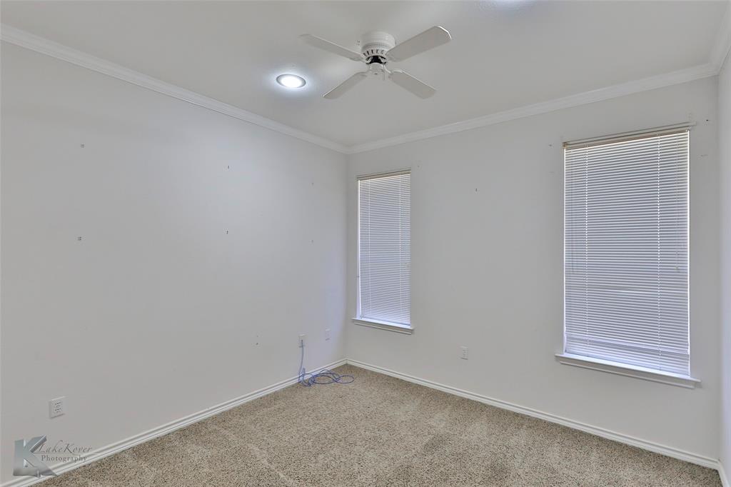 106 Riverside Park Abilene, TX 79605 - Photo 33 of 40 an empty room with windows and fan