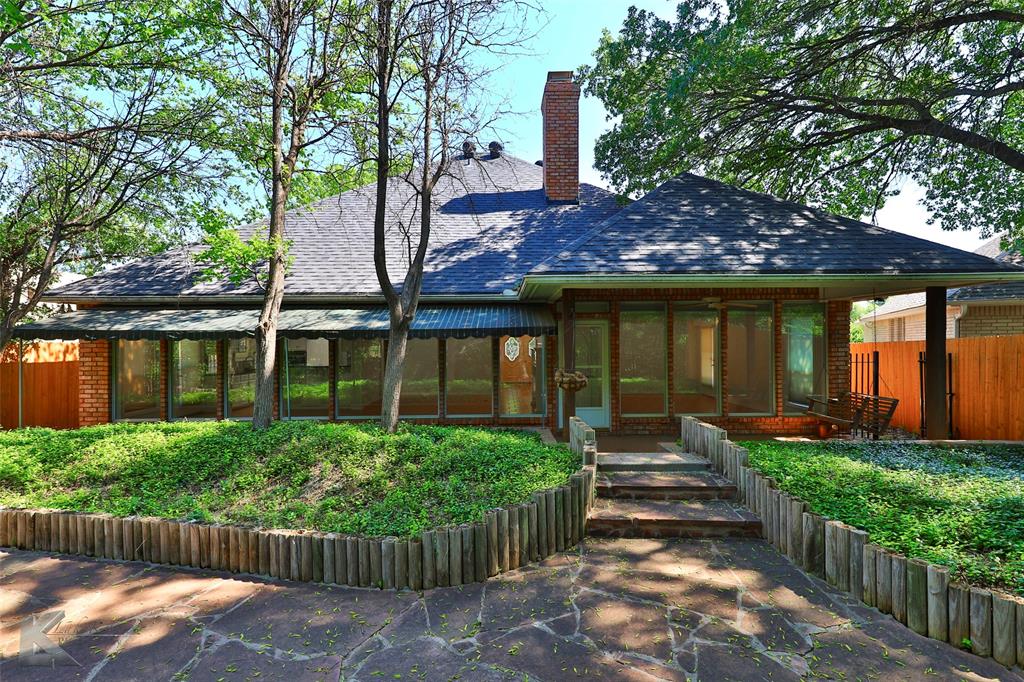 106 Riverside Park Abilene, TX 79605 - Photo 37 of 40 a front view of a house with garden
