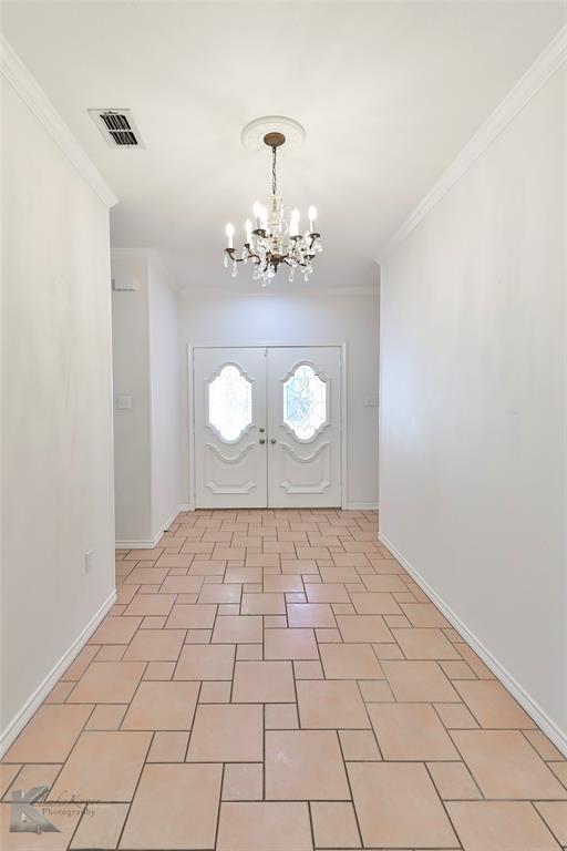106 Riverside Park Abilene, TX 79605 - Photo 4 of 40 a view of a room with wooden floor and a window