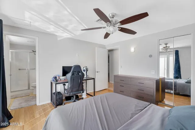 a bed room with a bed and furniture