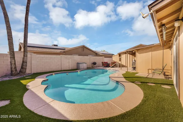 a view of a house with swimming pool