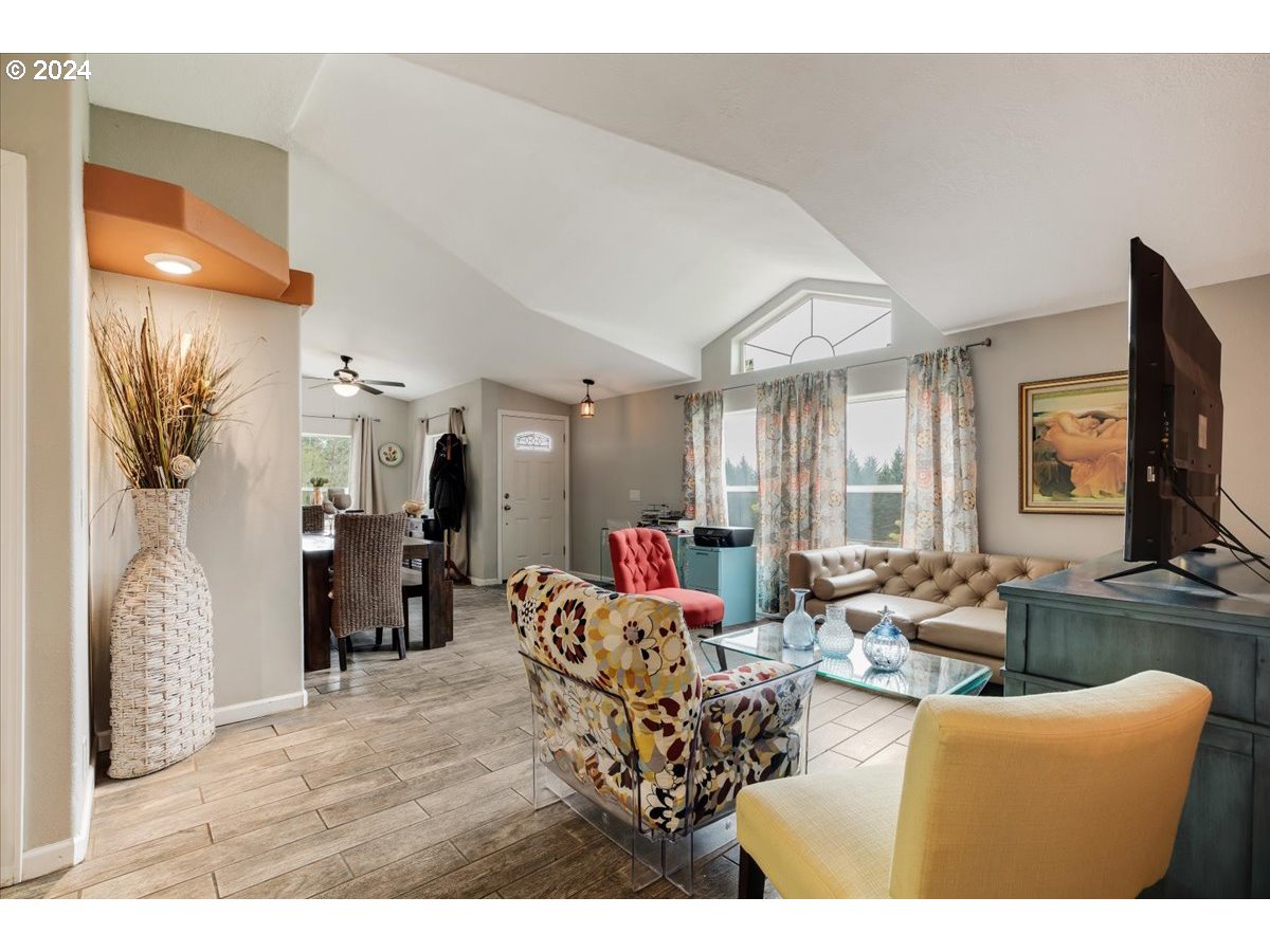 17771 Northwest Orchard View Road McMinnville, OR 97128 - Photo 12 of 36 a living room with furniture a flat screen tv and a window