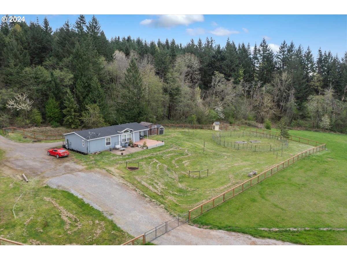 17771 Northwest Orchard View Road McMinnville, OR 97128 - Photo 34 of 36 a backyard of a house with table and chairs