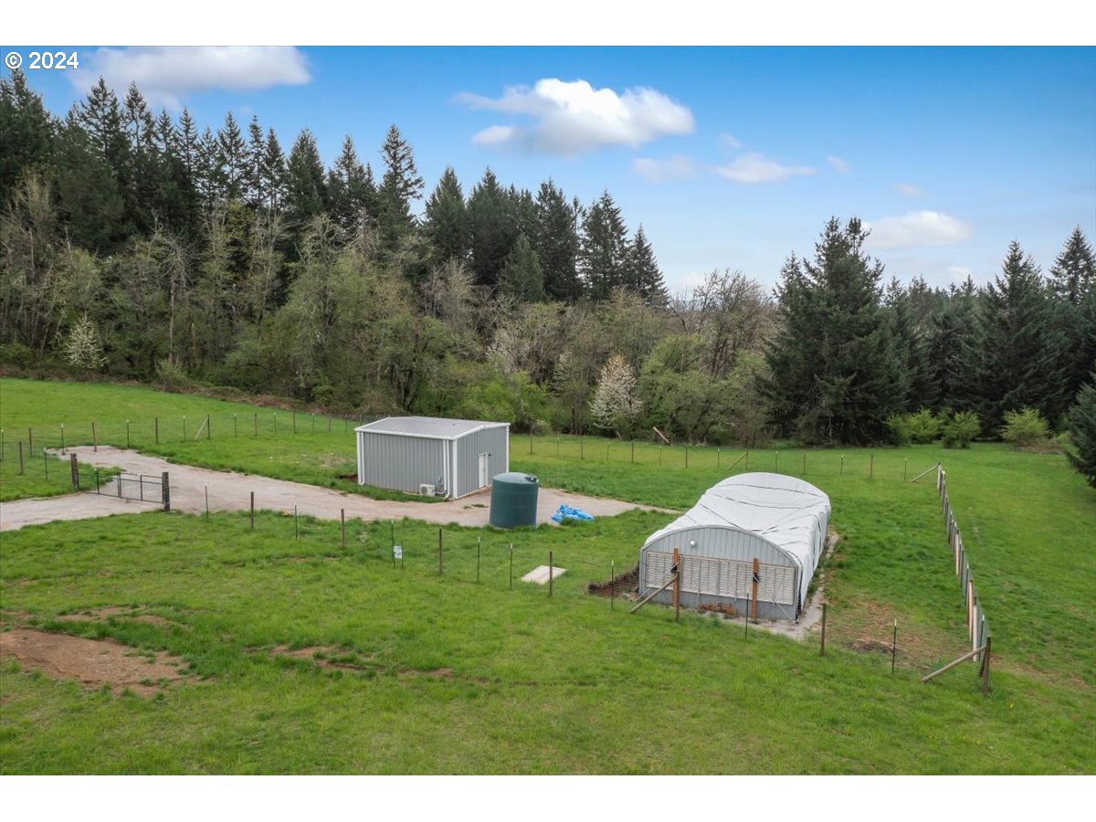 17771 Northwest Orchard View Road McMinnville, OR 97128 - Photo 36 of 36 a backyard of a house with table and chairs