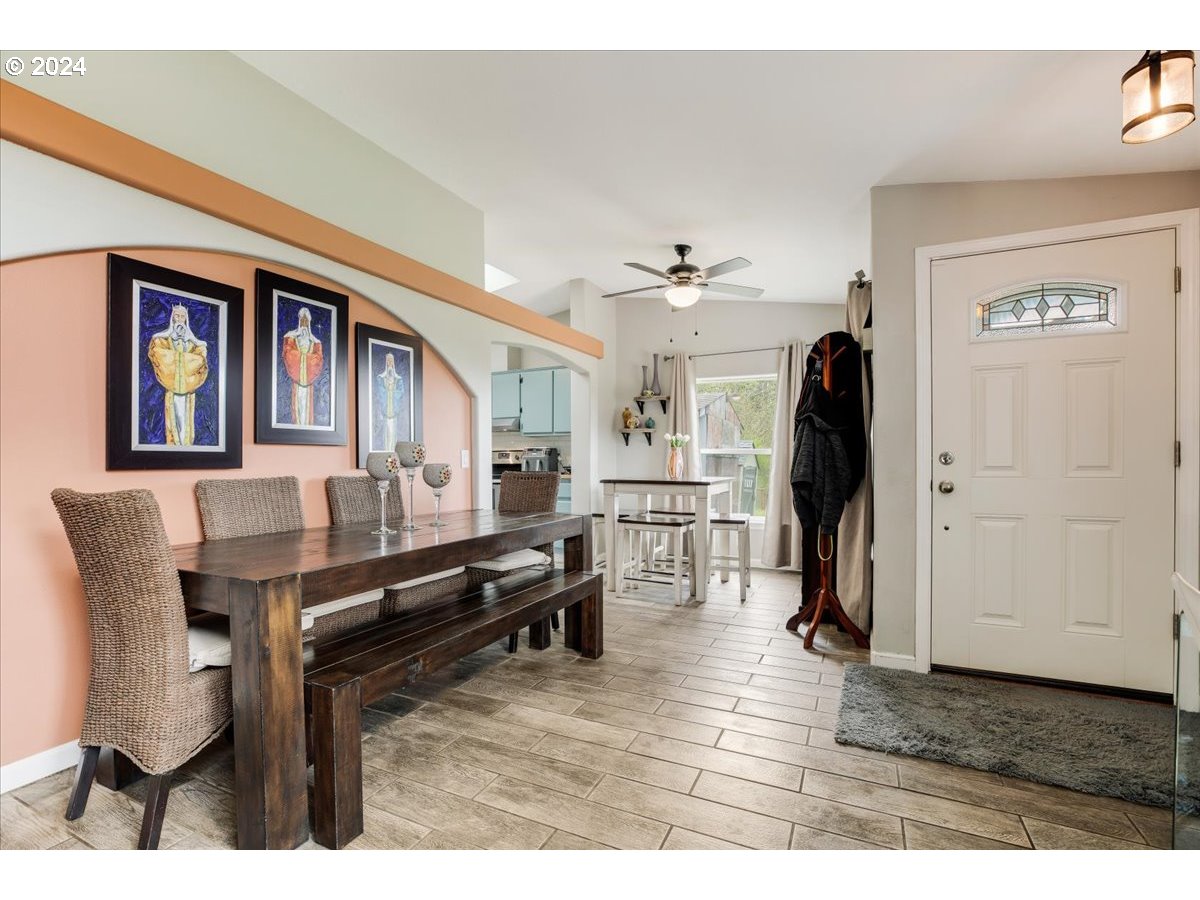 17771 Northwest Orchard View Road McMinnville, OR 97128 - Photo 7 of 36 a living room with furniture a desk and kitchen view