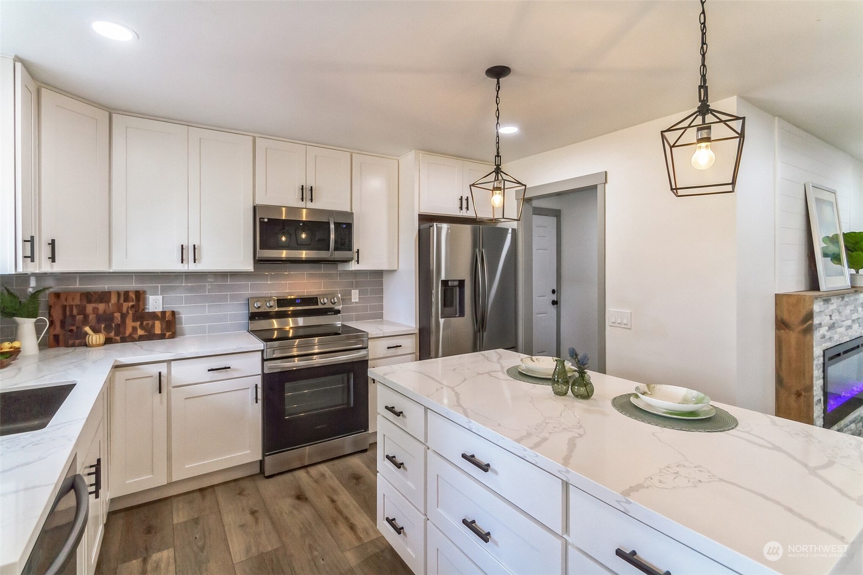 492 East Anderson Road Sequim, WA 98382 - Photo 20 of 33 a kitchen with a stove a sink and a refrigerator